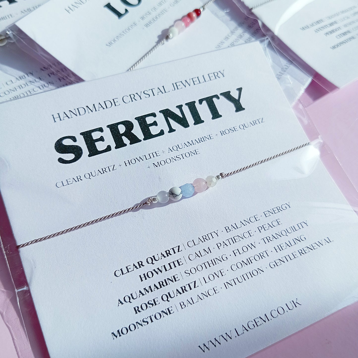 Serenity bracelet with clear quartz, howlite, aquamarine, rose quartz, and moonstone on a danity silk cord