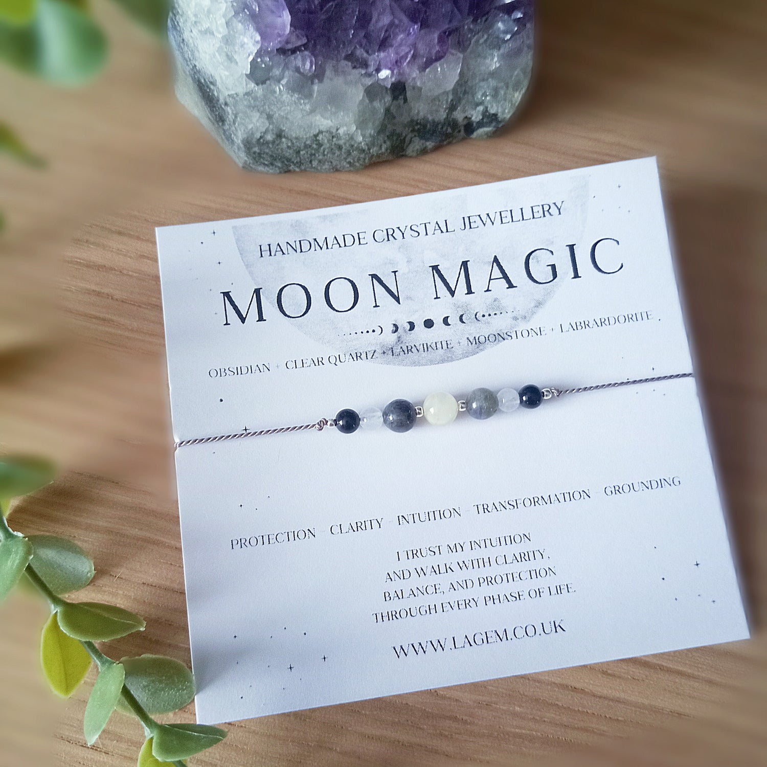 Moon Magic bracelet on a display card with crystals 