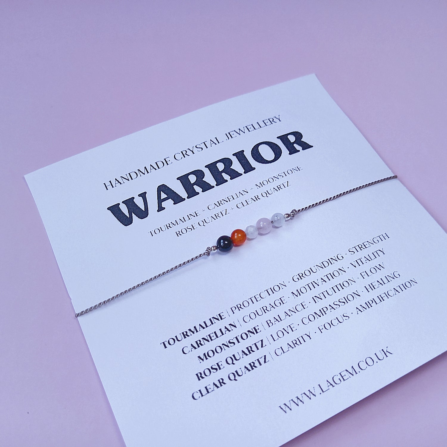 Crystal bracelet on a card with 'Warrior' design with natural stones 