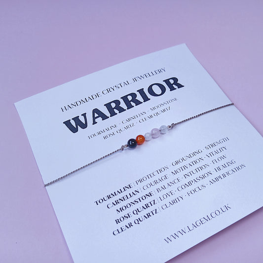 Crystal bracelet on a card with 'Warrior' design with natural stones 